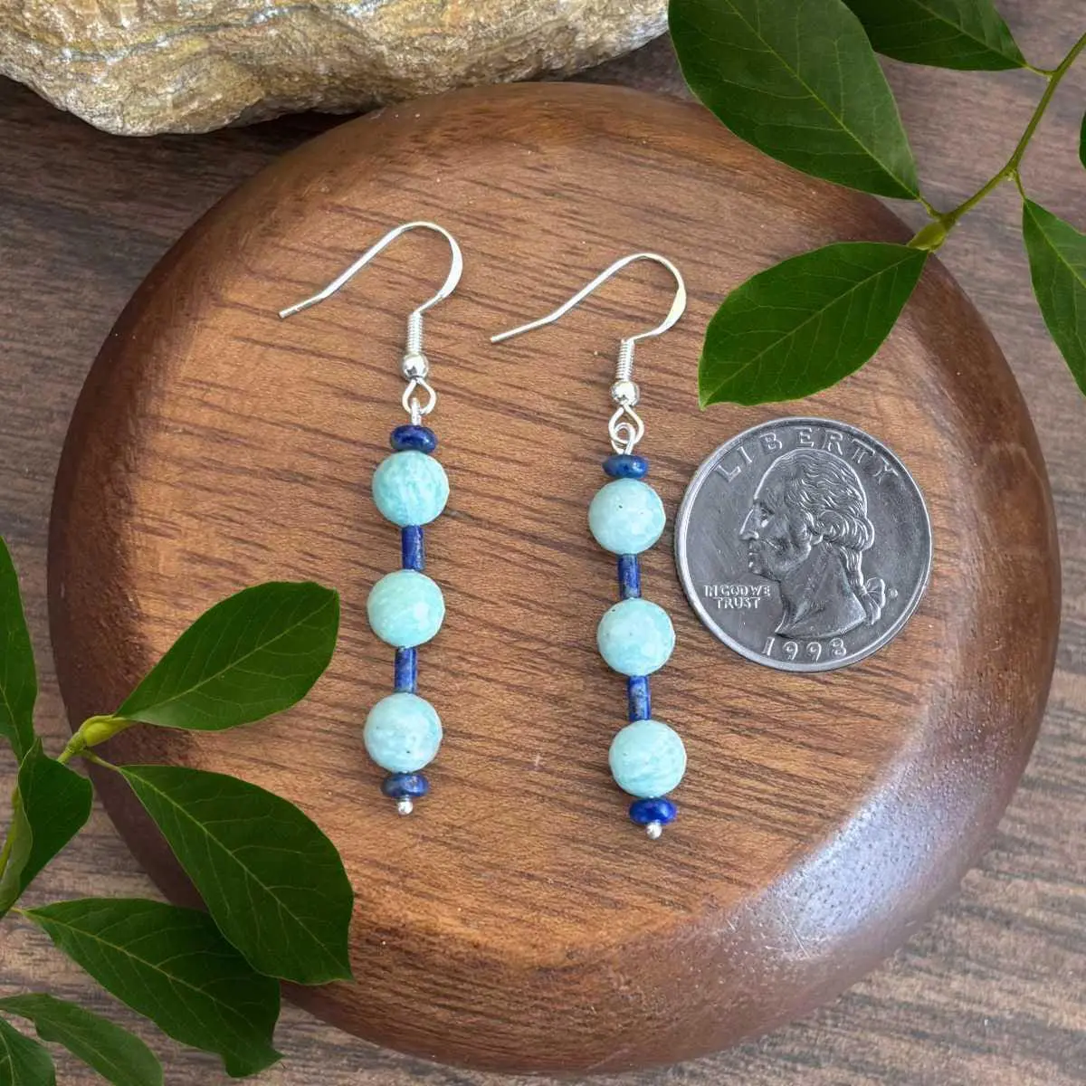an image of a pair of Amazonite and Lapis Lazuli Earrings next to a quarter
