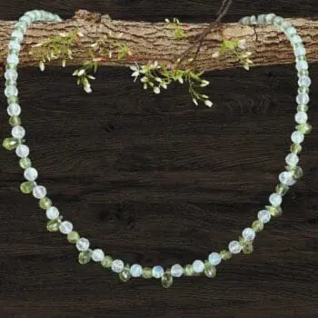 an image of a dainty Faceted Peridot and Rainbow Moonstone Necklace with 4mm faceted rainbow moonstone and peridot beads and eleven faceted small teardrop Peridot beads as focal pieces