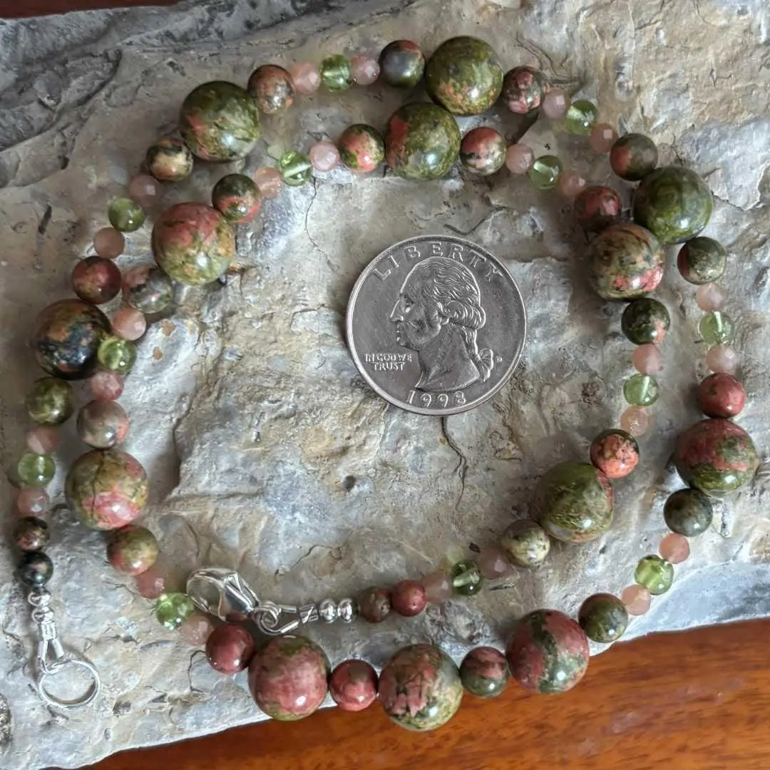 an image of a Unakite with Peach Moonstone and Peridot Necklace next to a quarter