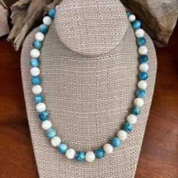 an image of a Round Apatite and Mother of Pearl Beaded Necklace with alternating apatite and mother of pearl beads that are each 10mm in size. It is finished off with sterling beads and lobster clasp