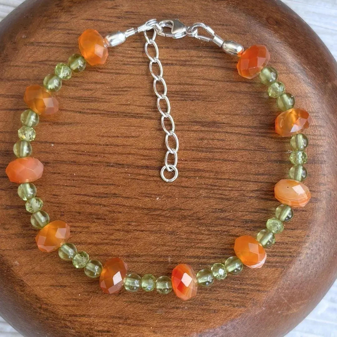 an image of a Carnelian and Peridot Beaded Bracelet with faceted rondelle carnelian beads alternating with trios of small peridot beads.
