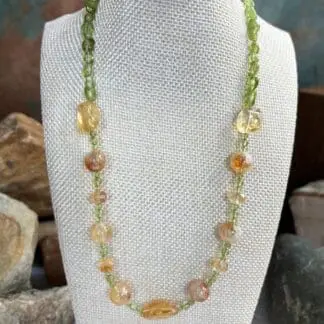 an image of a Citrine and Peridot Gemstone Necklace with assorted shapes of citrine beads and small round peridot beads and peridot small nuggets