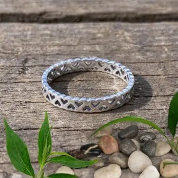 an image of a Sterling Silver Dainty Open Wraparound Hearts Ring with up and down open hearts that wrap all around the ring.