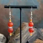 an image of a pair of Carnelian and Sterling Silver Beaded Earrings featuring 2 8mm round orange carnelian beads with 2 4mm faceted golden carnelian beads and sterling silver accents.