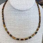 an image of a Tiger's Eye and Citrine Choker Necklace consisting of tiger's eye small tube beads separated by 4mm faceted citrine beads and finished with 4mm round tiger's eye beads going up the neck to the back