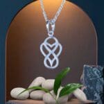 an image of an Everlasting Love Infinity Heart Sterling Silver Pendant showing an infinity symbol with a heart