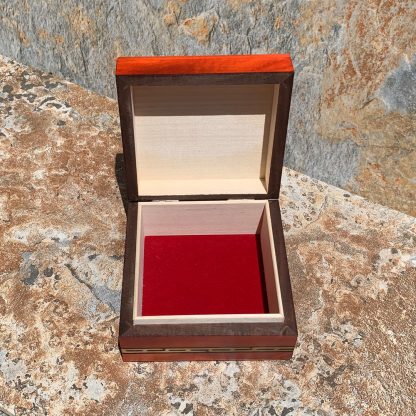 an image of a Handcrafted Labyrinth Wood Keepsake Box that is open showing the red velvet lining.