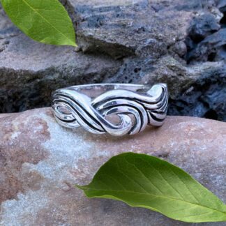 an image of a sterling silver ring with a design that looks like braided waves