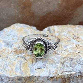 Oval Faceted Peridot Ring Set in Sterling Silver