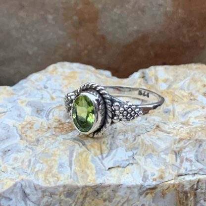 Oval Peridot Faceted Ring