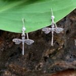 an image of a dainty pair of dangling sterling silver dragonfly earrings