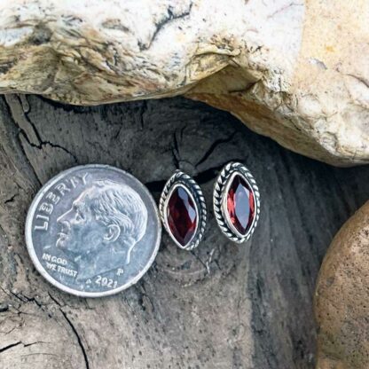 an image of our Sterling Silver and Marquise Garnet Stud Earrings next to a dime