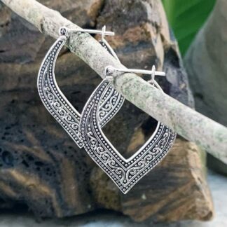 An image of our Elegant Sterling Silver Click Hoop Earrings with a bohemian oxidized pattern that come down to a curved vee.