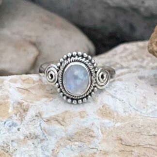 Sterling Silver and Oval Rainbow Moonstone Ring with a silver spiral on each side.