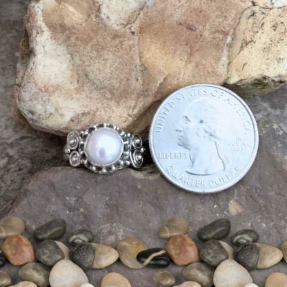 Pretty Pearl and Sterling Ring Next to Quarter