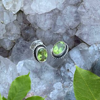 an image of Oval Faceted Peridot Stud Earrings Set in Sterling Silver