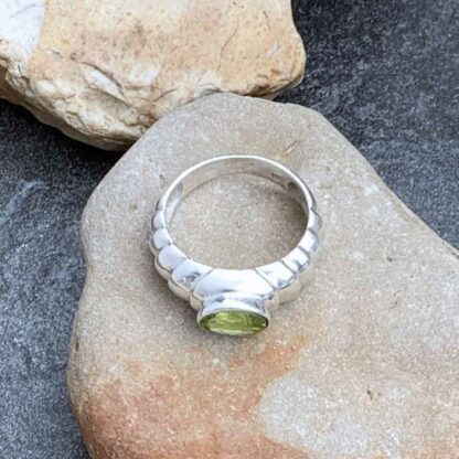 Contemporary Sterling Silver & Oval Faceted Peridot Ring Overhead View