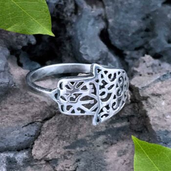 an image of a Hamsa Sterling Silver Filigree Ring that shows the hand wrapping around the front to the side.