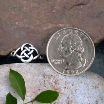 Sterling Celtic Interwoven Ring Next to Quarter