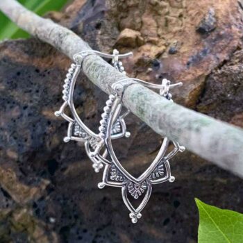 A photo of our Sterling Beaded Paddle Hoops going down in a vee design with a click closure.