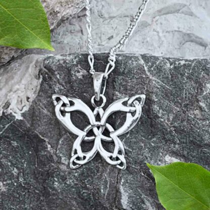 A photo of our sterling silver Triquetra Butterfly Pendant with the Celtic Triquetra knot on the end of each wing and in the center of the butterfly