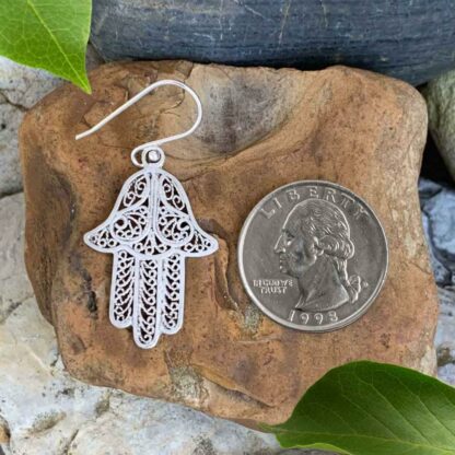 Berber Made Filigree Sterling Silver Hamsa Dangle Earrings Next to Quarter