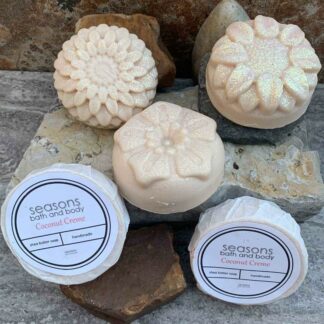 Coconut Creme All-Natural Soap in a round shape with each bar having a different floral design.