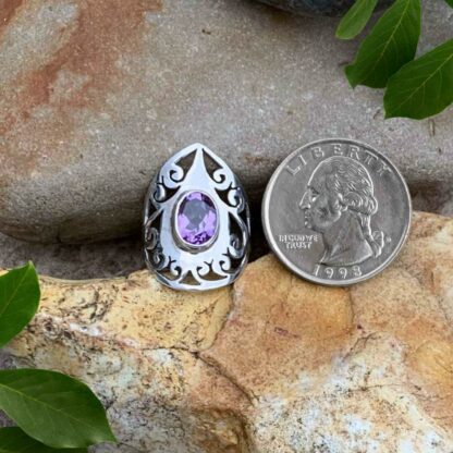 Pointed Filigree Sterling Silver Ring with Faceted Amethyst Gemstone Next to Quarter