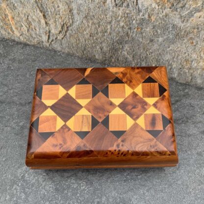 Geometric Moroccan Thuya and Lemon Wood Inlaid Box. Dimensions: Length: 4.75 inches x Width: 3.188 inches x Height: 2 inches (Inside compartments measurements: Width: 1.75 inches x Length: 2. 625