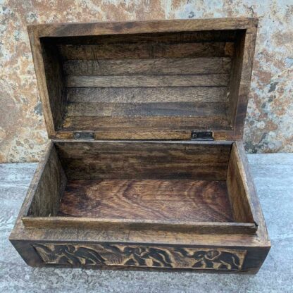 Primitive Hand Carved Mango Wood Elephant Trunk Box With 2 elephants on top and three elephants across the front. All the trunks are up. Dimensions are 9" Long x 5.25" Wide x 5.25" High. This view shows the lid open