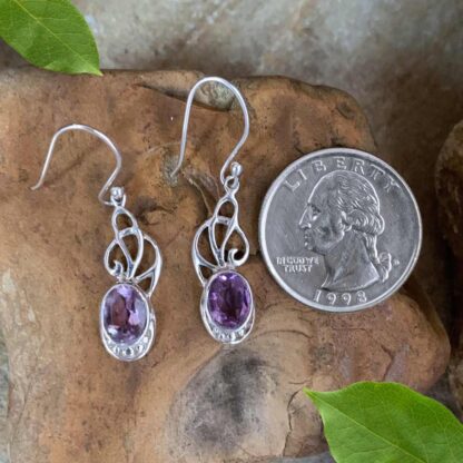 An image of our elegant Sterling Ribbons and Oval Faceted Amethyst Dangle Earrings