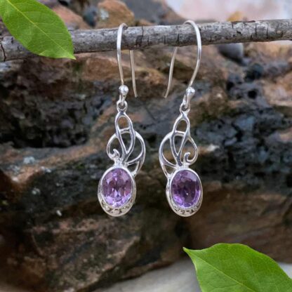 An image of our elegant Sterling Ribbons and Oval Faceted Amethyst Dangle Earrings