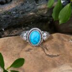 an image of an Oval Turquoise and Sterling Silver Ring with a heart on each side
