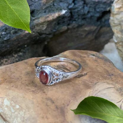 An image of our Petite Faceted Oval Garnet and Filigree Sterling Silver Ring Side View