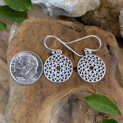 An image of our Sterling Silver Round Open Multi-Heart Dangle Earrings Next to a Dime