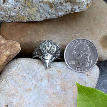 Sterling Silver Eagle Head Ring Next to Quarter