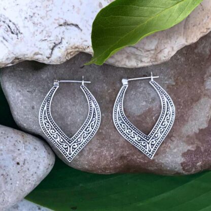 An image of our Elegant Sterling Silver Click Hoop Earrings with a bohemian oxidized pattern that come down to a curved vee.