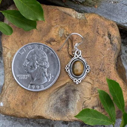 an image of a pair of Oval Tiger's Eye and Sterling Silver Earrings. Dimensions are Total Drop: 1.18 inches x Width: .51 inches