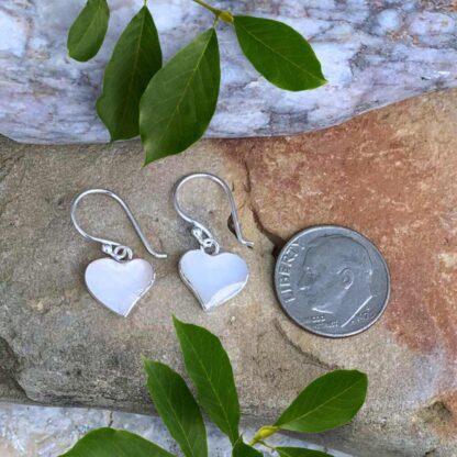 Mother of Pearl Heart and Sterling Silver Earrings Next to Dime