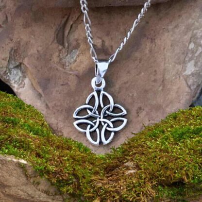 An image of a pendant with four triquetra or trinity celtic knots interwoven in sterling silver. The pendant has a total drop of .813 inches by a width of .50 inches