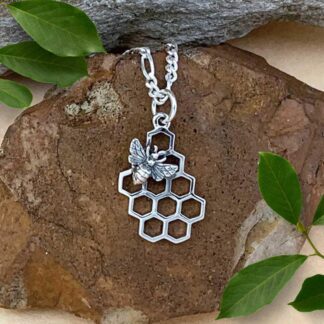 an image of a sterling silver open honeycomb with a bee on the top left corner