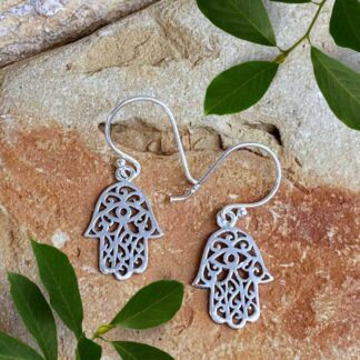 an image of a petite dangly pair of Sterling Silver Filigree Hamsa Earrings with an eye in the center of the palm section of the hand