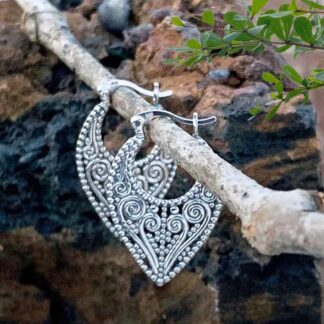 an image of a pair of Boho Filigree Heart Sterling Silver Click Hoop Earrings with a swirling heart that works down to the point at the base.