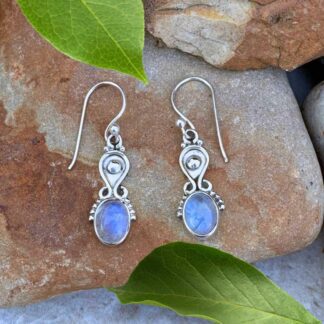an image of a pair of Sterling Silver and Oval Rainbow Moonstone Earrings. These are dainty with a slight amount of dangle