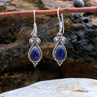 an image of a pair of Princess Teardrop Lapis Lazuli and Sterling Silver Earrings with a teardrop shaped lapis gemstone surrounded by sterling silver with delicate silver beads at the bottom and a bit of dangle