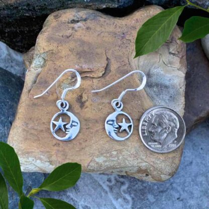 an image of a pair of Celestial Sterling Silver Half Moon and a Star Dangle Earrings next to a dime