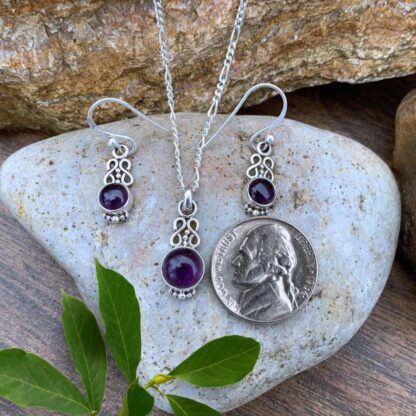 an image of a dainty round Sterling Silver and Amethyst Infinity Jewelry Set with a double infinity symbol above each gemstone