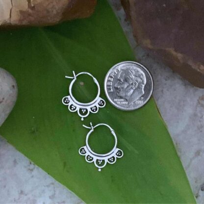 an image of a pair of Sterling Silver Petite Feminine Click Hoop Earrings next to a dime