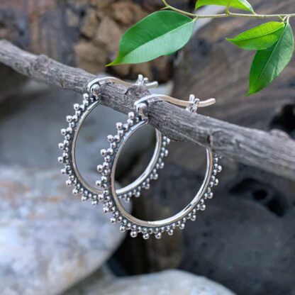 an image of a round pair of Sterling Silver Bohemian Click Hoops with silver bead work all around the edge