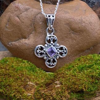 an image of a Dainty Amethyst and Sterling Silver Pendant with a diamond shaped faceted amethyst in the center